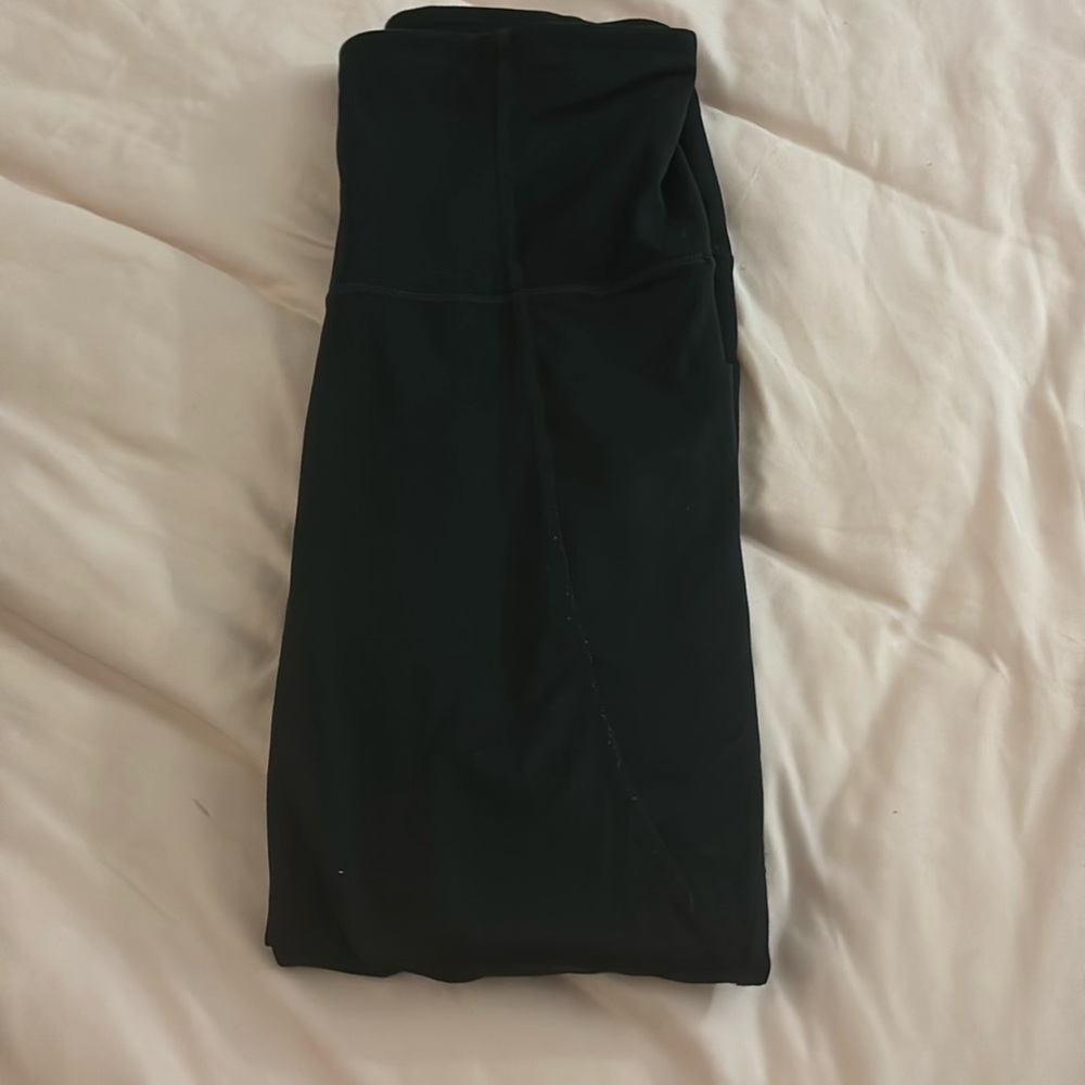 Two pairs of black all in motion leggings, size small and medium